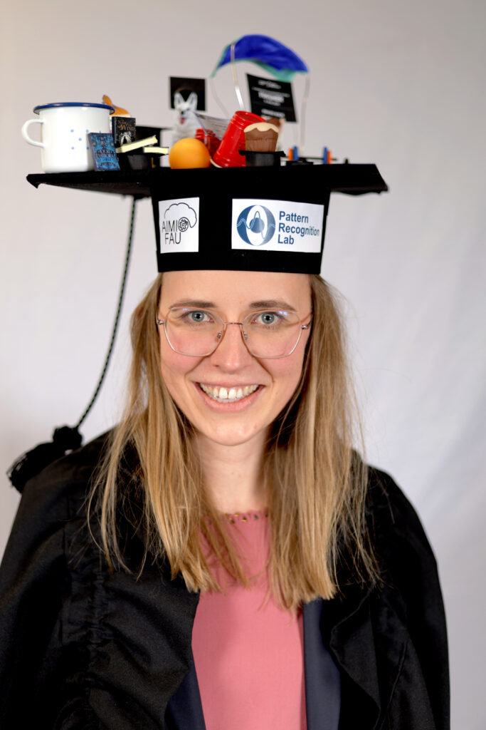 The freshly minted Dr. Frauke Wilm, proudly wearing her creatively designed graduation cap. (Image: Mathias Seuret)