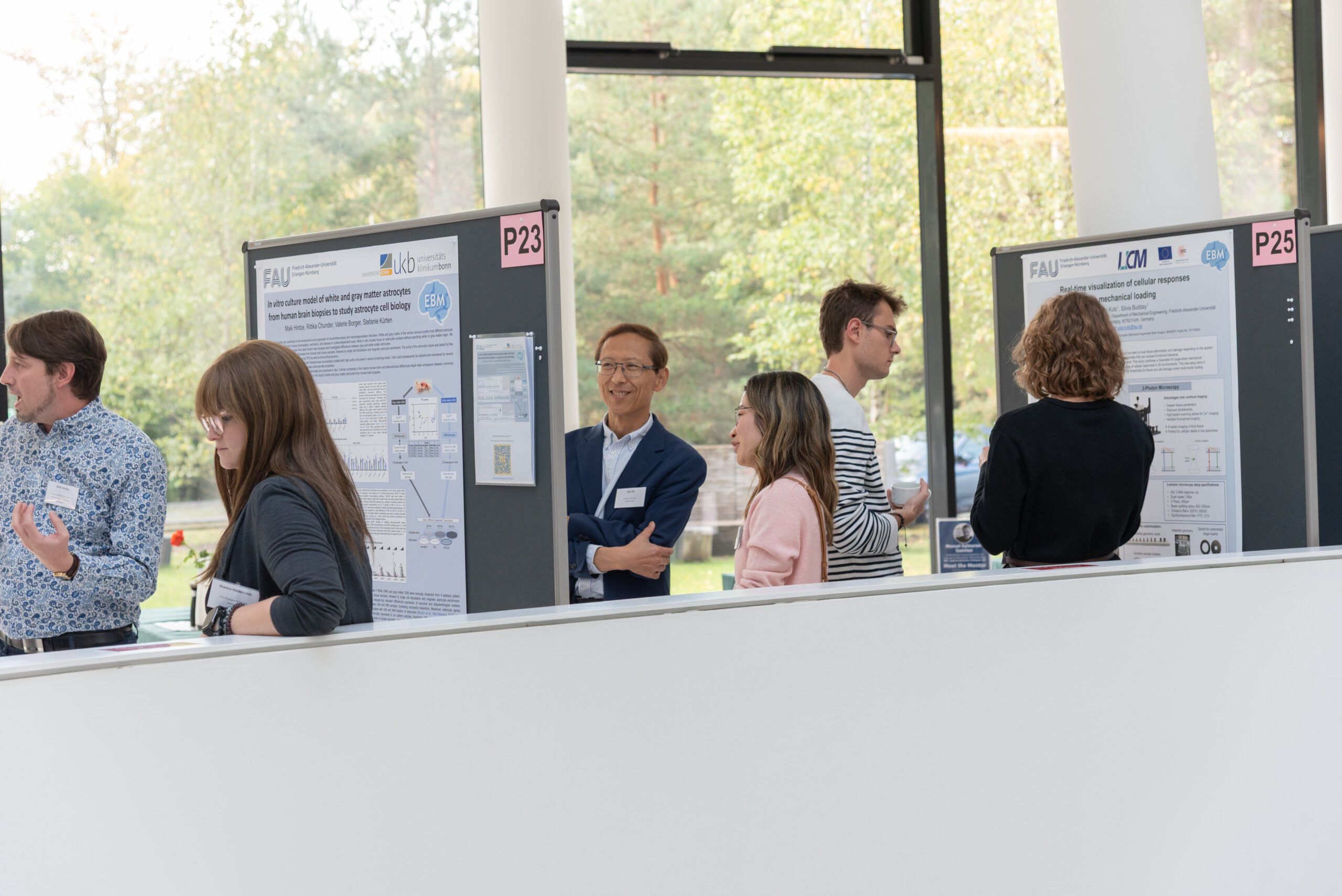 Engaging discussions during the poster session at the EBM Symposium 2025 (Image: S. Viezens)