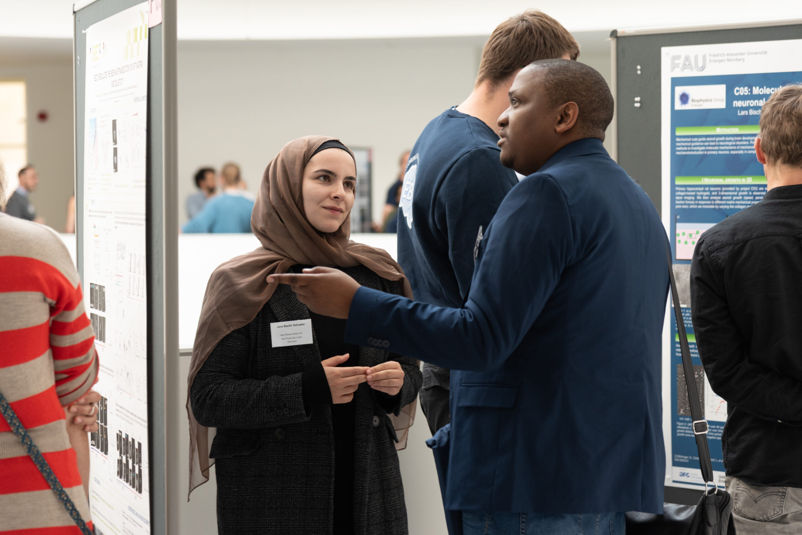 Engaging discussions during the poster session at the EBM Symposium 2025 (Image: S. Viezens)