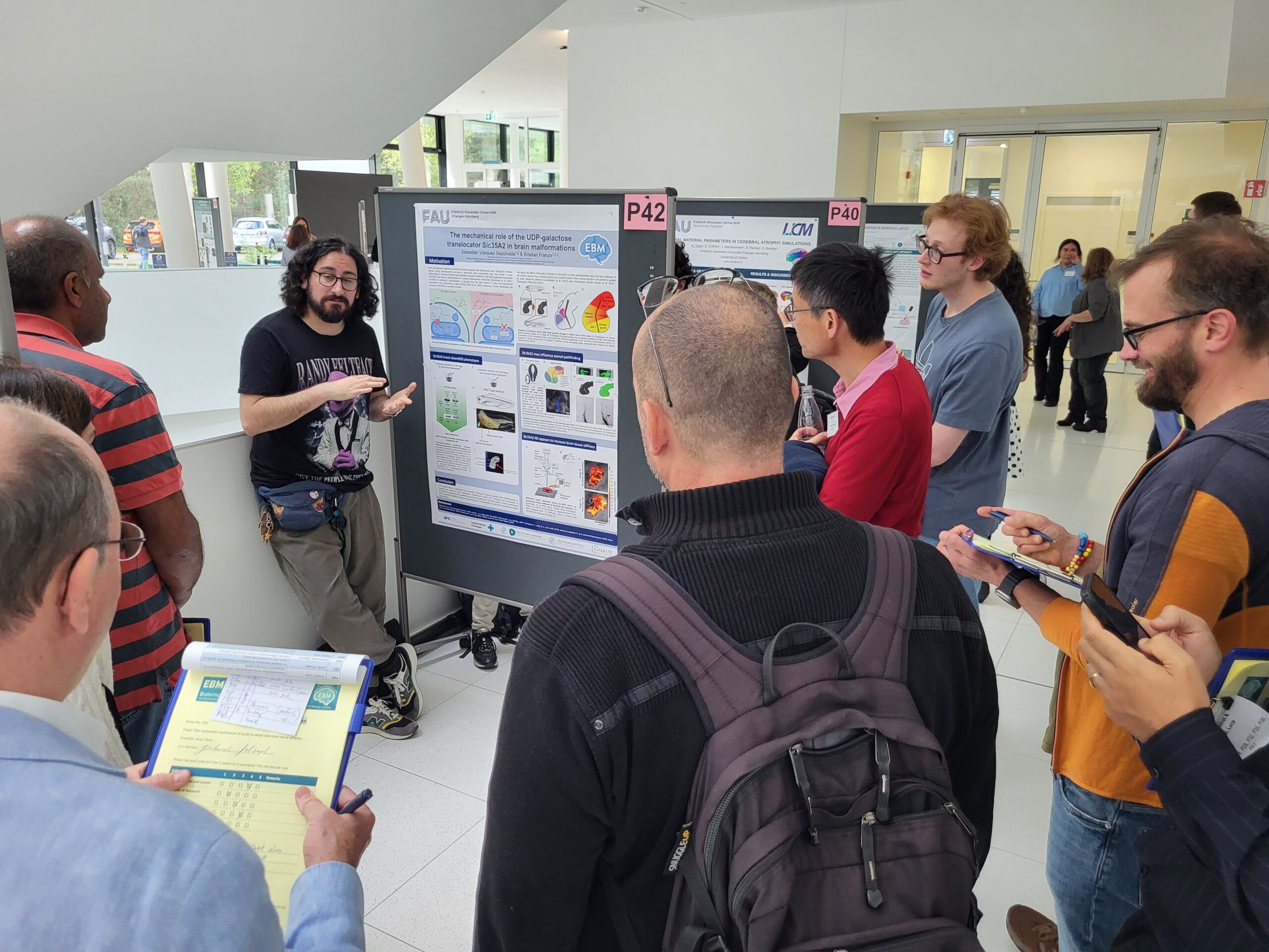 Engaging discussions during the poster session at the EBM Symposium 2025 (Image: A. Dakkouri-Baldauf)