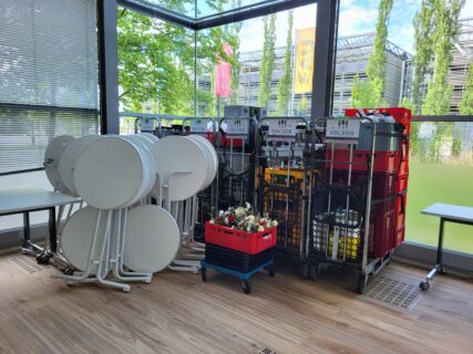 Behind the scenes: stacked tables, flower crates, and catering carts — the quiet aftermath of a big event. Photo: A. Dakkouri-Baldauf