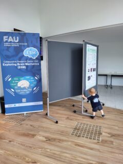 The smallest EBM member, hard at work rearranging the poster walls. Photo: A. Dakkouri-Baldauf